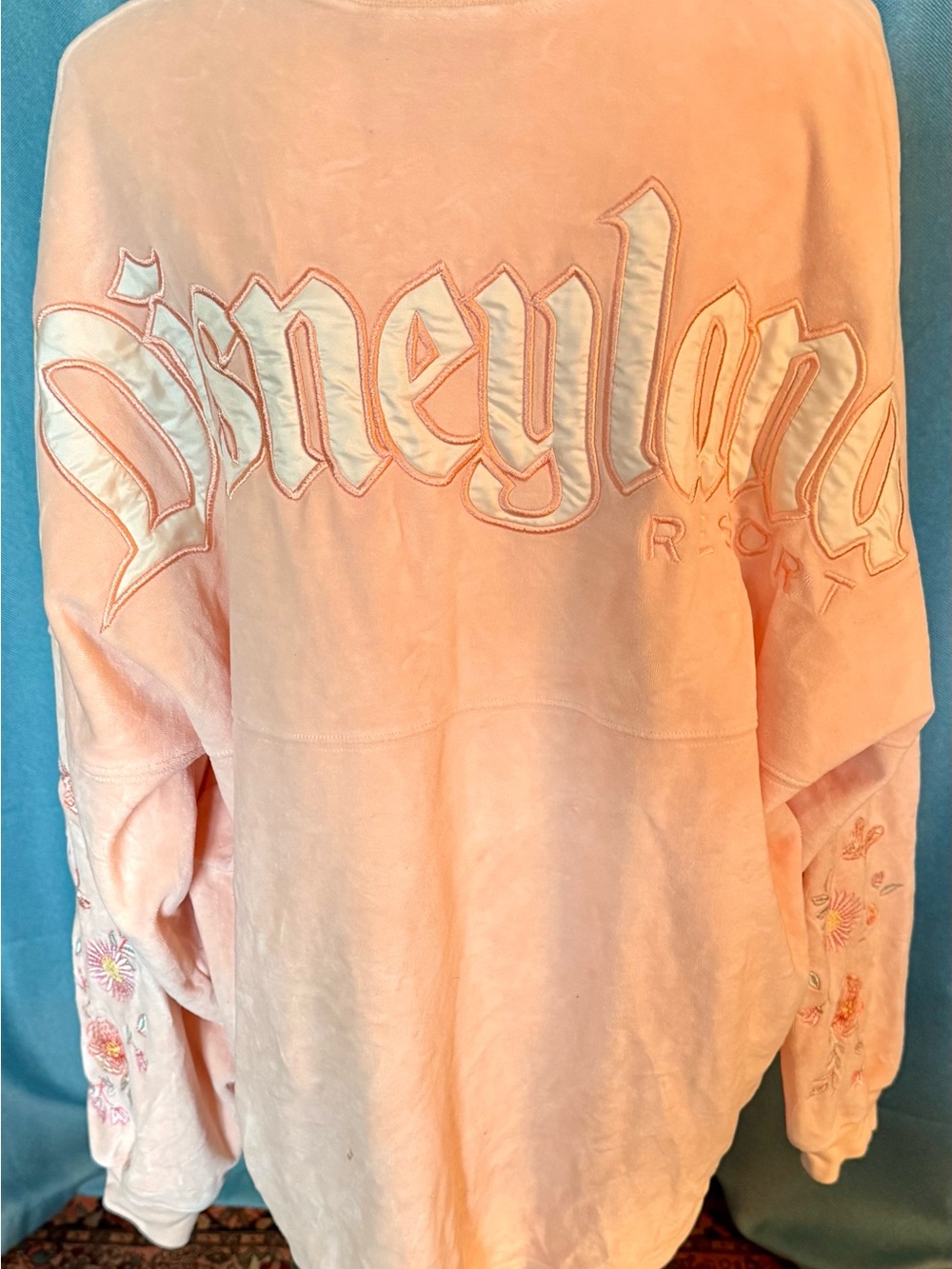 Disney Peach Velour Spirit Jersey with Satin Letters and Embroidered Sleeves - Picture 1 of 5